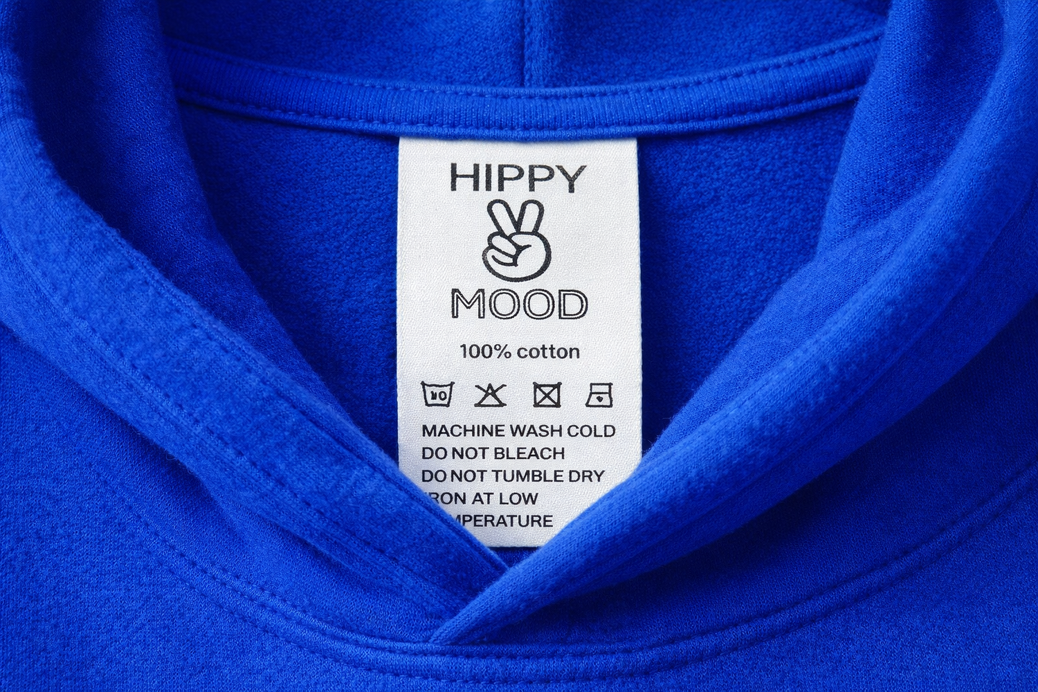Blue fabric with a label reading 'Hippy Mood' and washing instructions.